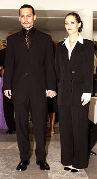 Johnny Depp and his wife Vanessa Paradis at the premiere of "From Hell."