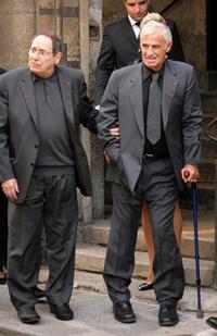 Jean-Paul Belmondo and Robert Hossein at the funeral of French actor and filmmaker Jean-Claude Brialy.