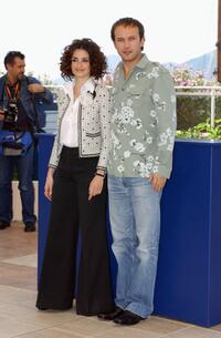 Penelope Cruz and Vincent Perez at the photocall of "FanFan La Tulipe" during the 56th International Cannes Film Festival.