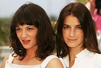 Asia Argento and Joana Preiss at the photocall of "Boarding Gate" during the 60th International Cannes Film Festival.