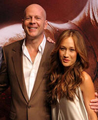 "Live Free or Die Hard" stars Bruce Willis and Maggie Q at a Tokyo press conference.