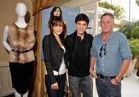 Michael Rady, Rachael Kemery and Guest at the Illia display during the 67th Annual Golden Globe Awards.