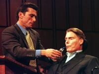 Christopher Reeve is assisted as he testifies during a hearing on stem cell research.