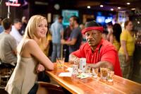Jordana Spiro as Ivy Selleck and Ving Rhames as Jibby Newsome in "The Goods: Live Hard, Sell Hard."