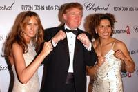 Melania Knauss, Donald Trump and Lucia Rijker at the 13th Annual Elton John Aids Foundation Academy Awards Viewing Party.
