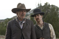 Harrison Ford as Colonel Dolarhyde and Sam Rockwel as Doc in "Cowboys & Aliens."
