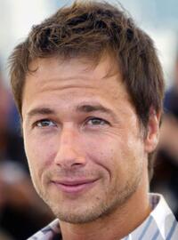 Stephane Rousseau at the photocall of "Les Invasions barbares" during the 56th Cannes film festival.