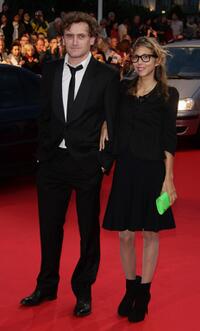 Jean-Paul Rouve and Guest at the screening of "Mama Mia" during the opening ceremony of the 34th US Film Festival.