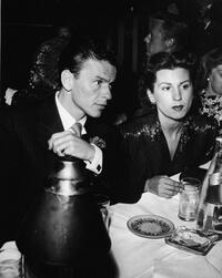 Frank Sinatra and first wife Nancy Barbatto at a restaurant.