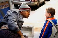 Will Smith as Hancock and Atticus Shaffer in "Hancock."