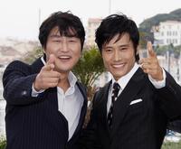 Song Kang-ho and Lee Byung-Hun at the photocall of "The Good, the Bad, the Weird" during the 61st International Cannes Film Festival.