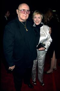 Rod Steiger and date at the Los Angeles premiere of "End of Days".