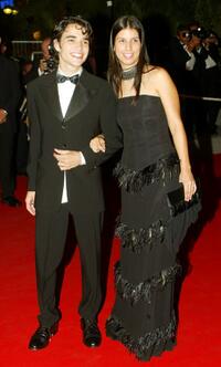 Caio Blat and Guest at the screening of "Carandiru" during the 56th International Cannes Film Festival.