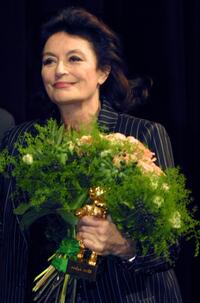 Anouk Aimee at the Berlinale Film Festival, clutches her Golden Bear Award for lifetime achievement.