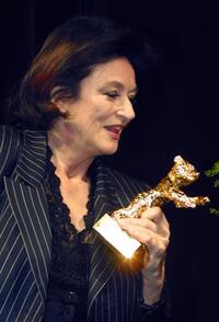 Anouk Aimee at the Berlinale Film Festival, clutches her Golden Bear Award for lifetime achievement.