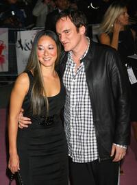 Quentin Tarantino with a guest at the Golden Age Of Couture party.