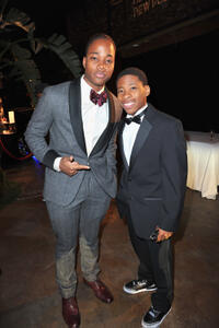 Leon Thomas III and Guest at the 43rd NAACP Image Awards in California.
