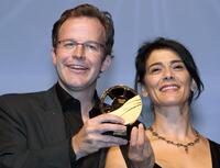 Director Tom Mc Carthy and Hiam Abbass at the award ceremony during the 34th US Film Festival.
