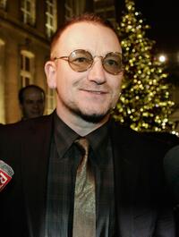 Bono talks at the Elysee Palace after a meeting with French President Nicolas Sarkozy.