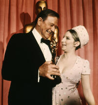 John Wayne accepts his Oscar for "True Grit"