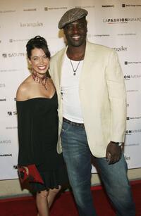 Adewale Akinnuoye-Agbaje and Guest at the 2006 Los Angeles Fashion Awards.