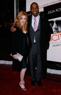 Rick Worthy and Guest at the premiere of "Duplicity."