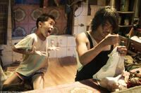 Xu Jiao as Dicky Chow and Stephen Chow as Ti Chow in "CJ7."