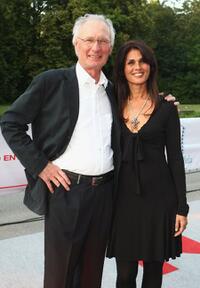 Arthur Brauss and Guest at the Movie Meets Media party.