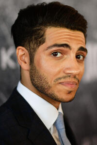 Mena Massoud at the premiere of "Tom Clancy's Jack Ryan" in San Pedro, California.