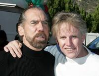 Gary Busey poses with John Paul DeJoria at the annual party.
