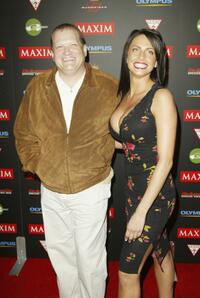 Drew Carey and Guest at the Maxim "Hot 100" party.