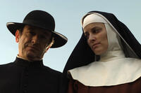 Adriano Luz as Father Dinis and Maria Joao Bastos as Angela de Lima in ``Mysteries of Lisbon.''