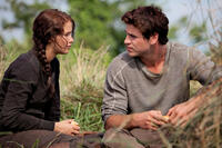 Jennifer Lawrence as Katniss Everdeen and Liam Hemsworth as Gale Hawthorne in "The Hunger Games.''