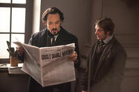 John Cusack as Edgar Allan Poe and Sam Hazeldine as Ivan in ``The Raven.''
