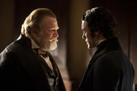 Brendan Gleeson as Captain Hamilton and Luke Evans as Detective Fields in ``The Raven.''