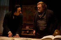 John Cusack as Edgar Allan Poe and Brendan Gleeson as Captain Hamilton in ``The Raven.''