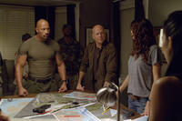 Dwayne Johnson as Roadblock and Bruce Willis as Colton in ``G.I. Joe: Retaliation.''