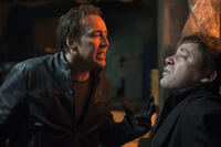 Nicolas Cage as Johnny Blaze and Cristian Iacob as Vasil in ``Ghost Rider: Spirit of Vengeance.''