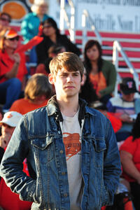 Tony Oller as Travis in ``Beneath the Darkness.''