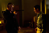 Dolph Lundgren as Andy Spector and Sean Faris as David Nash in ``Stash House.''