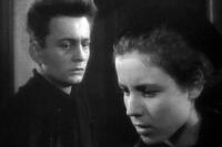 Claude Laydu as Priest of Ambricourt and Nicole Ladmiral as Chantal in ``Diary of a Country Priest.''
