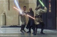 Obi-Wan, Darth Maul and Qui-Gon Jinn fighting in the Naboo Hangar.
