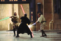 Qui-Gon Jinn, Darth Maul, and Obi-Wan fighting in the Naboo Hangar.