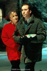 Jack Campbell (Nicolas Cage) and Kate (Tea Leoni), the woman he left behind years ago, in "The Family Man".