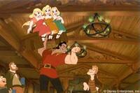 Village heartthrob Gaston demonstrates his manliness by "bench-pressing" a trio of serenading maidens as the locals offer a musical tribute to him.
