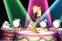 Fiery candelabra Lumiere (center) leads a choir of dinnerware in inviting Belle to "be our guest" at the Beast's castle in this memorable musical number.