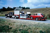 Mini-cooper on the back of a truck to capture the driving experience in "The Human Body."