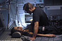 Chris Kelvin (George Clooney) ponders the shocking appearance of his beloved wife Rheya (Natascha McElhone) aboard a space station.