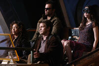 Gina Torres as Zoe, Nathan Fillion as Captain Malcolm Reynolds, Adam Baldwin as Jayne and Summer Glau as River in "Serenity."