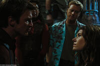 Trouble brews on ship as the crew of "Serenity" Gina Torres as Zoe, Alan Tudyk as Wash and Jewel Staite as Kaylee argue with Nathan Fillion as Captain Malcolm Reynolds.